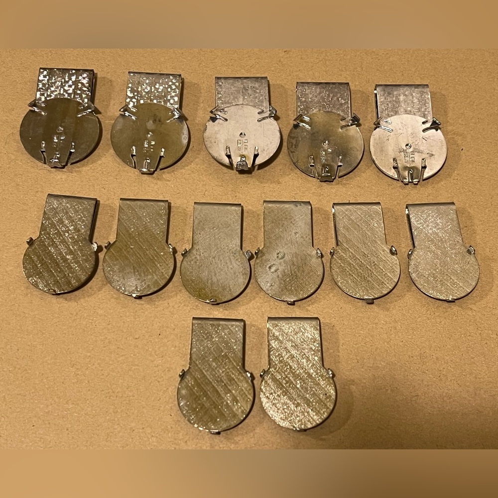 LOT OF 13 SILVER COLORED METAL MONEY CLIPS.
